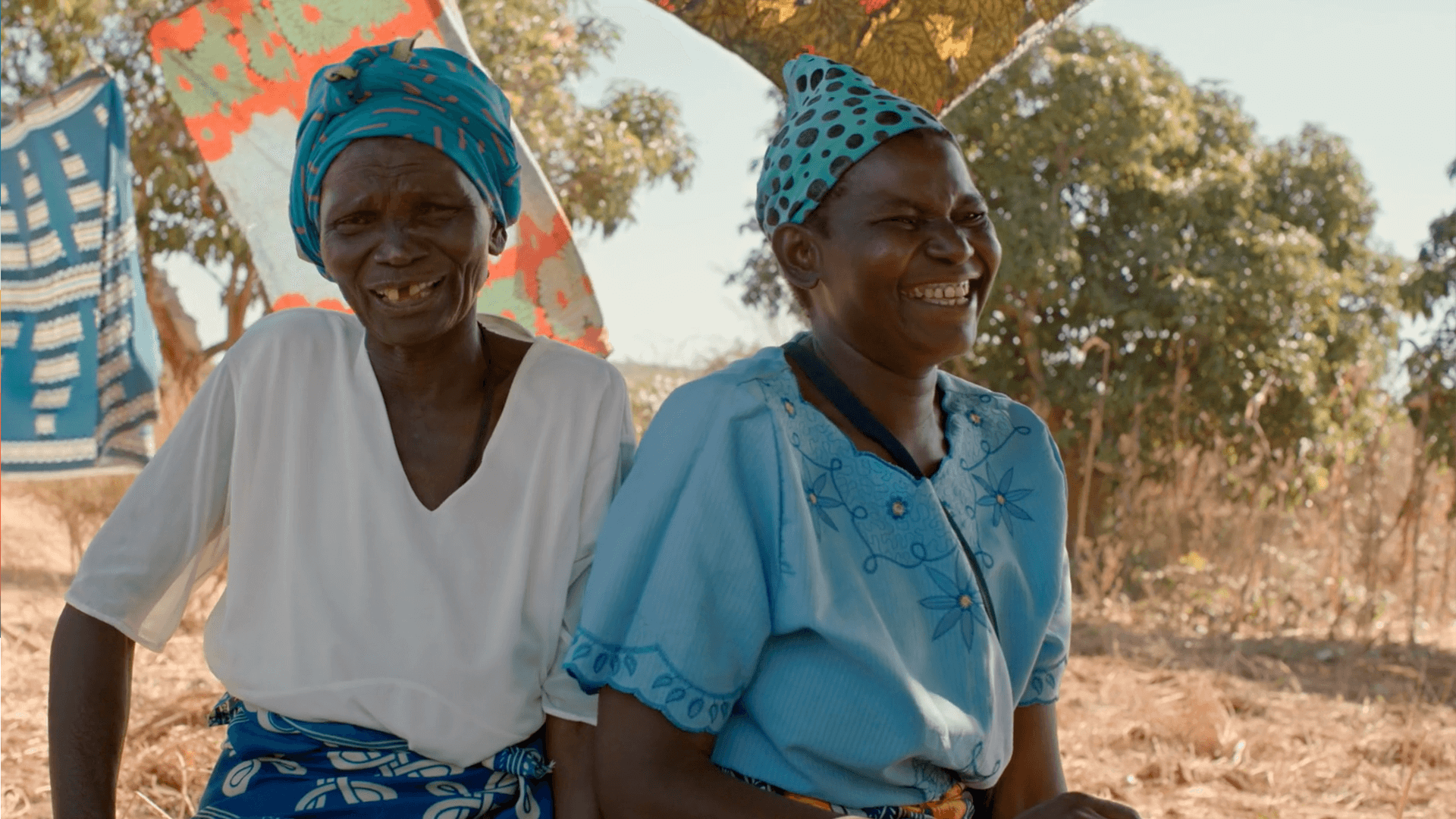 Still from the VANDAL produced World Vision featuring two women in head scarfs laughing