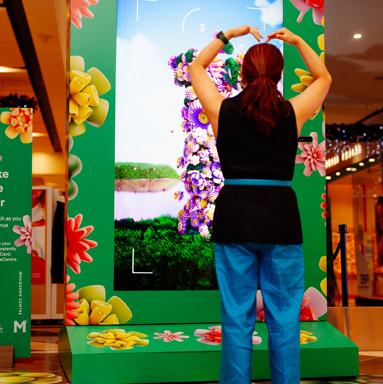 Shoppers interacting with the VANDAL Magic Mirror™ for the Macquarie Center 'Spring Into Action' Experiential campaign