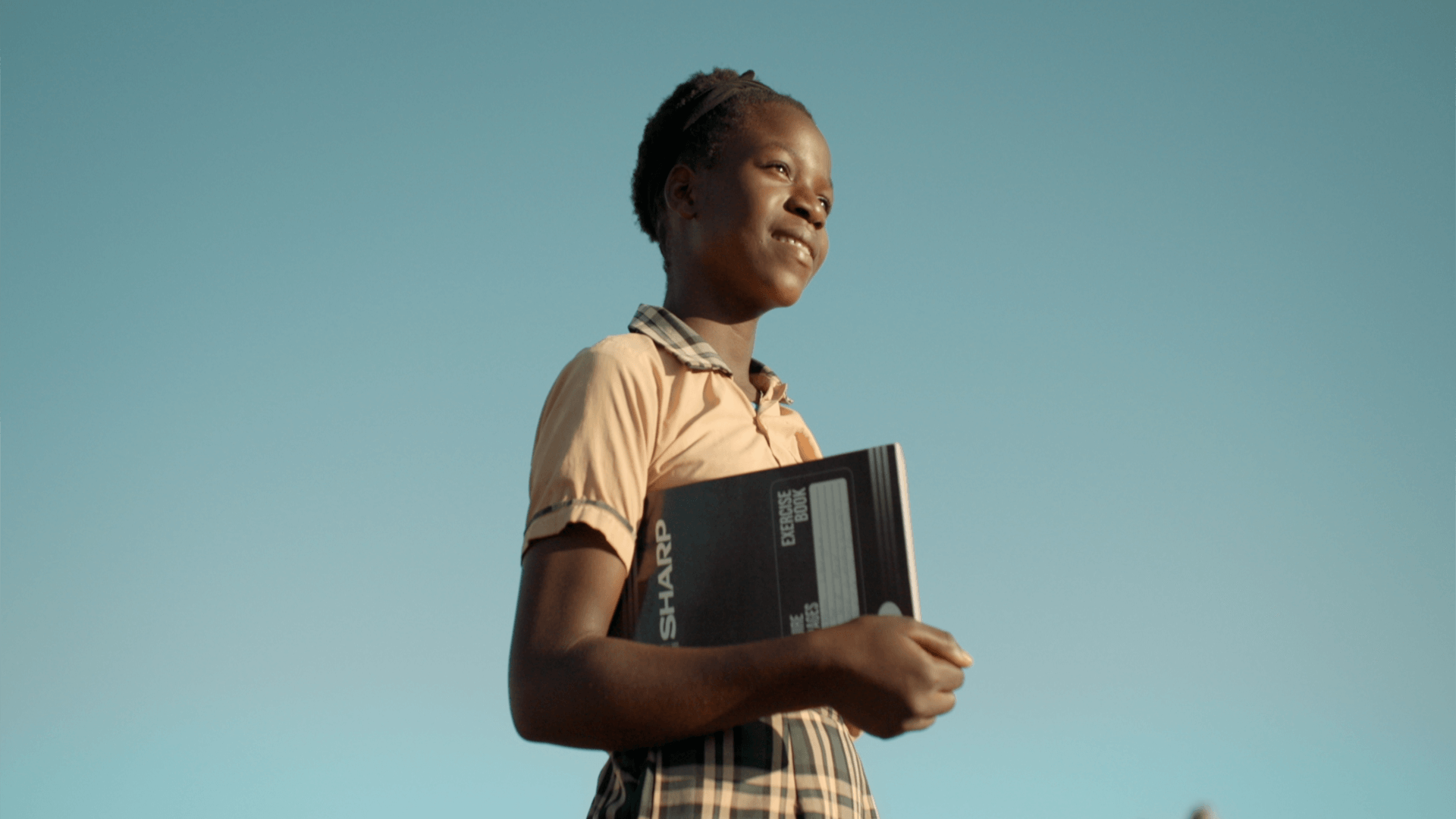 Still from the VANDAL produced World Vision commercial featuring a young woman with a book