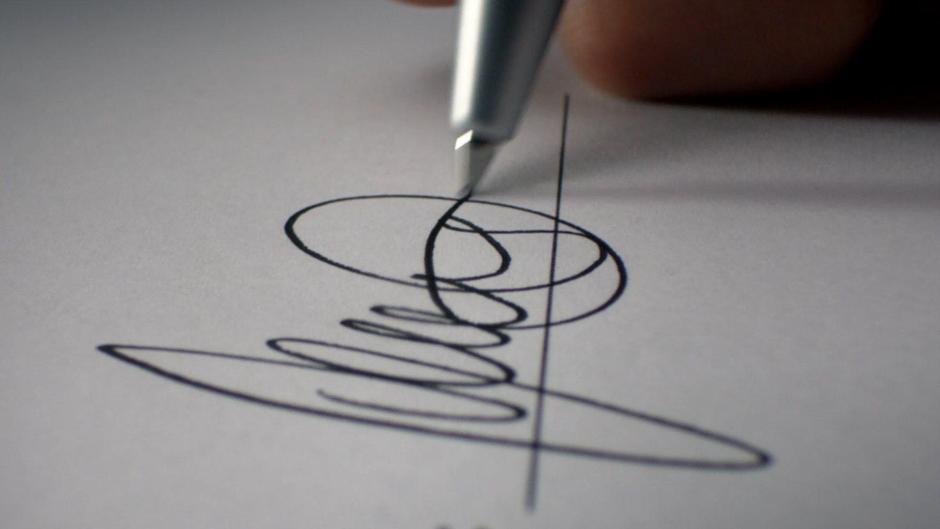 Still from the VANDAL produced Audi Choice TVC featuring the tip of a pen placing a signature on paper