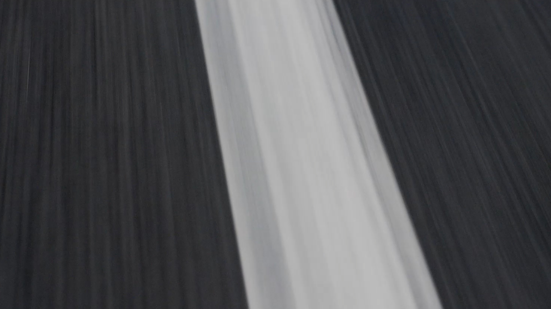 Still from the VANDAL produced Audi Choice TVC featuring a motion blurred white line of a road