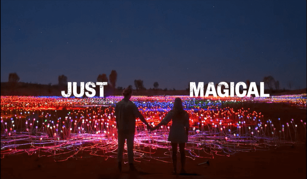 Voyages 'Just Wow' Uluru Ayers Rock Resort campaign featuring 2 people holding hands at field of light