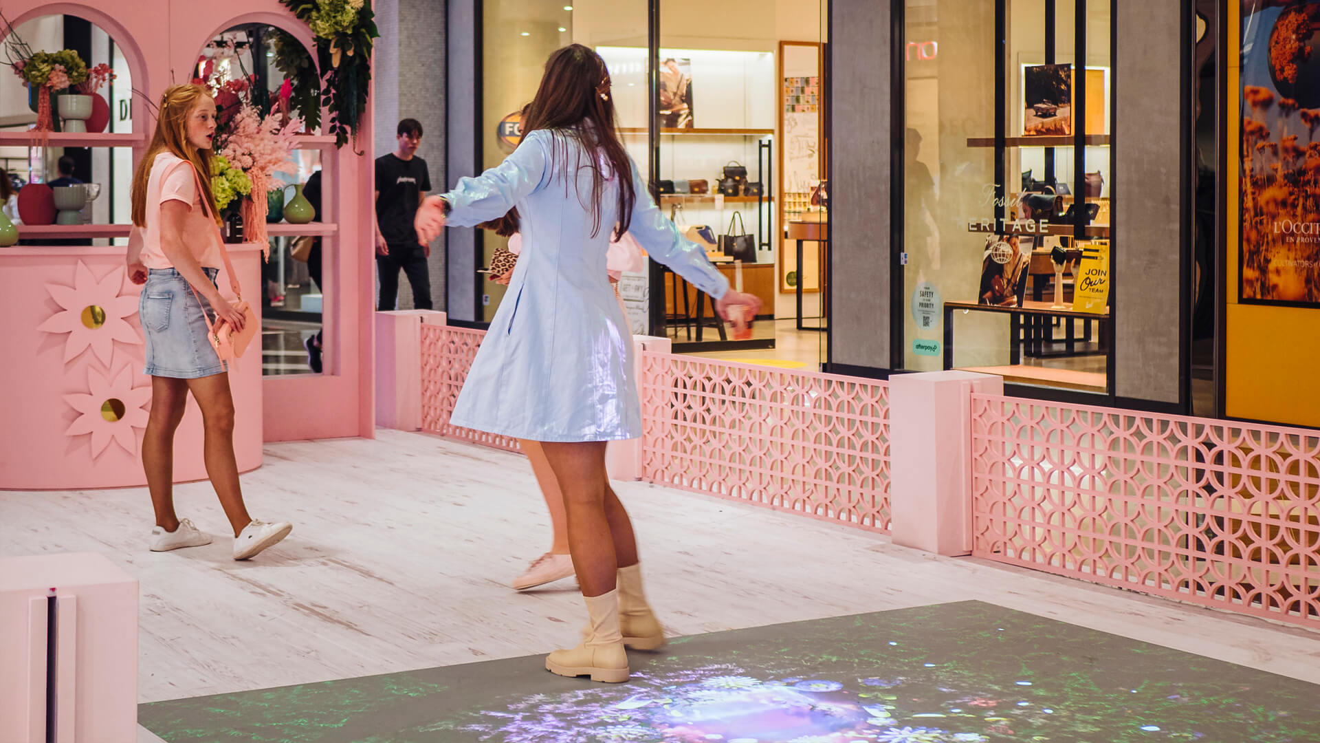 Shoppers enjoying the Macquarie Center Uplifting Spirits Spring experiential brand activation by VANDAL