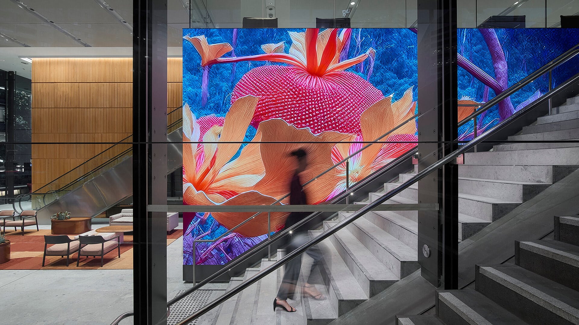 A woman rushes past an AI generated artwork depicting the Natural Rhythms of Australia.